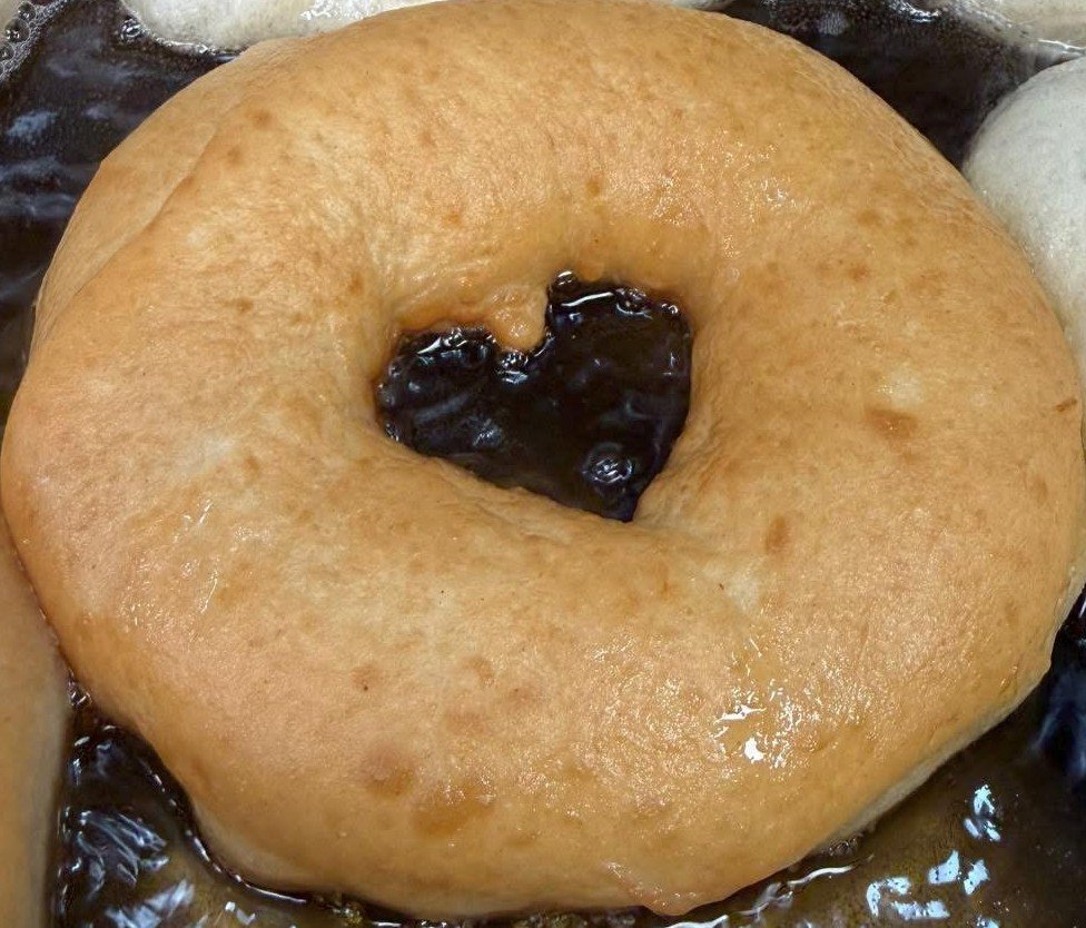 Sometimes in the middle of the hurry and scurry  One of our team, while frying, took time to notice that one donut had a perfect shaped heart